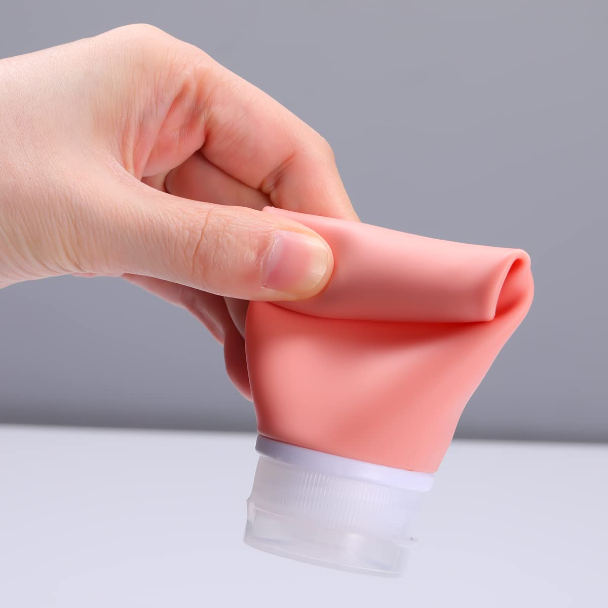 Leak Proof Silicone Travel Bottles 4 Pack 2oz Liquid Squeezable Refillable Portable Travel Accessories/Cosmetic Containers BPA Free Travel Size Bottles for Toiletries Shampoo Conditioner Lotion