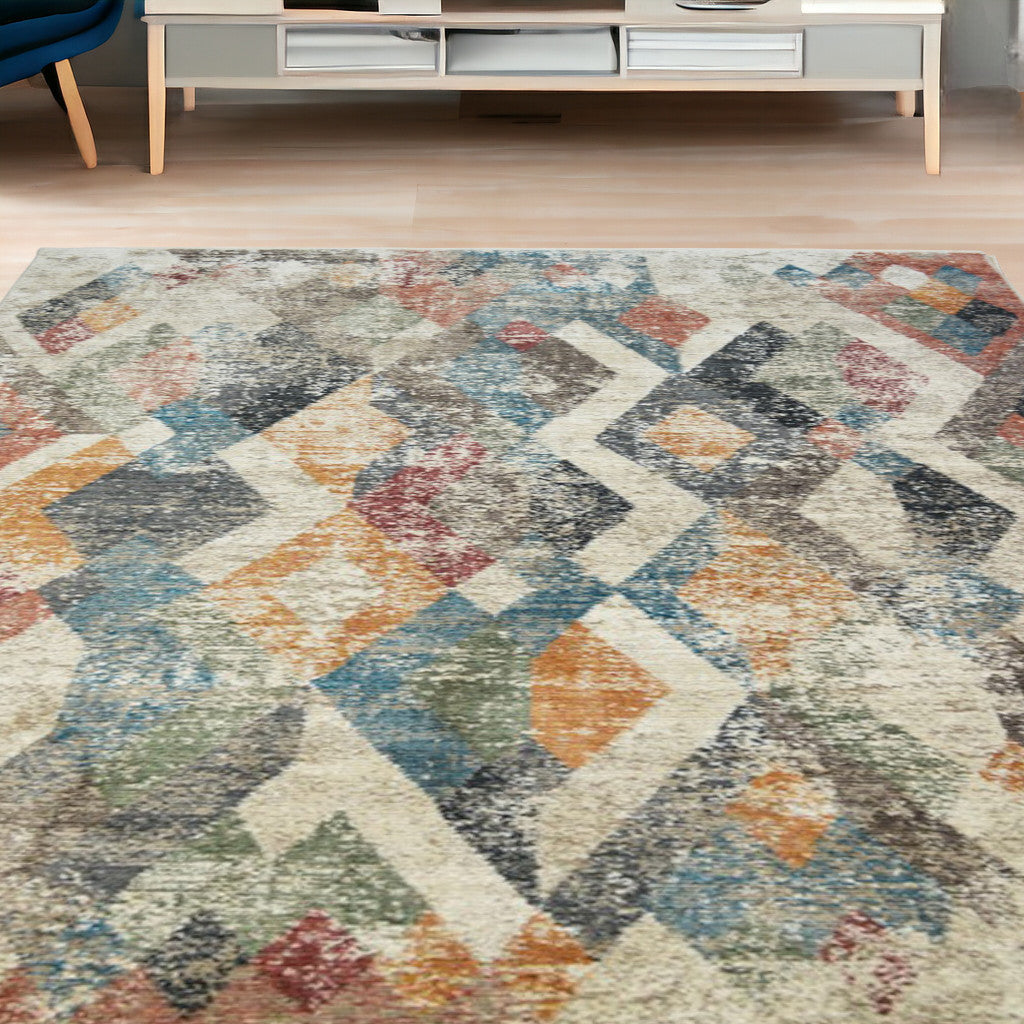 5 X 8 Beige Blue and Gray Geometric Distressed Area Rug With Fringe