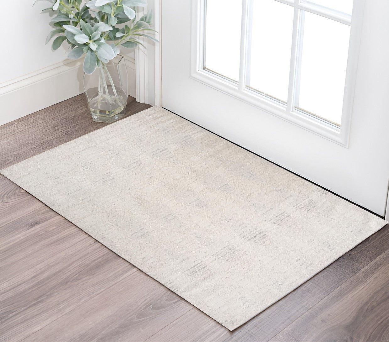 2 X 5 Cream and Beige Geometric Area Rug