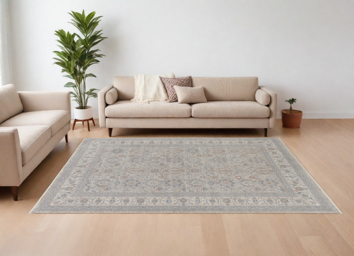 9 X 13 Silver Taupe and Blue Oriental Power Loom Worn Faded Area Rug With Fringe