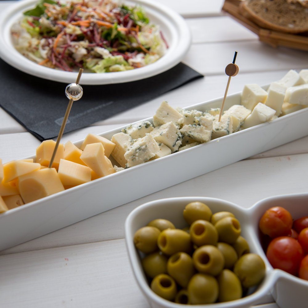 Restaurantware Siluro 16.3 Inch Olive Tray 1 Narrow Olive Plate - Microwave-Safe Oven-Safe White Porcelain Narrow Serving Tray C