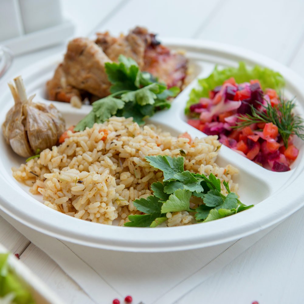 Restaurantware Bagasse Three Compartment Plate Round Compartment Plate Party Plate - 10'' - Durable All Natural Premium Disposab