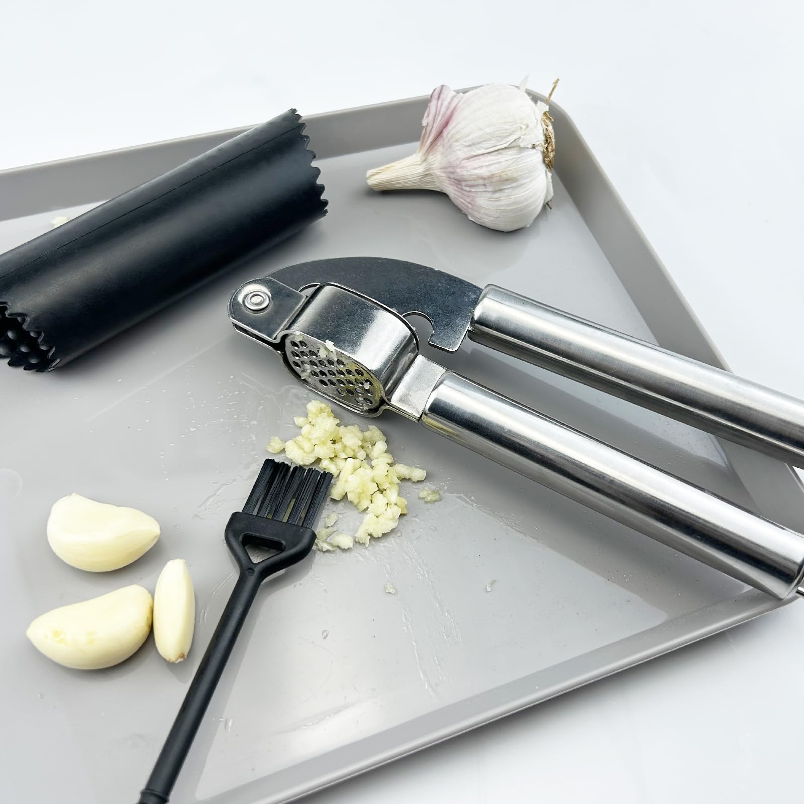 Nutabevr Kitchen Garlic Press  Stainless Steel Garlic Mincer  Sturdy and Non-Rust Garlic Press  with Silicone Peeler and Cleaning Brush  Easy to Clean and Wash the Dishwasher.
