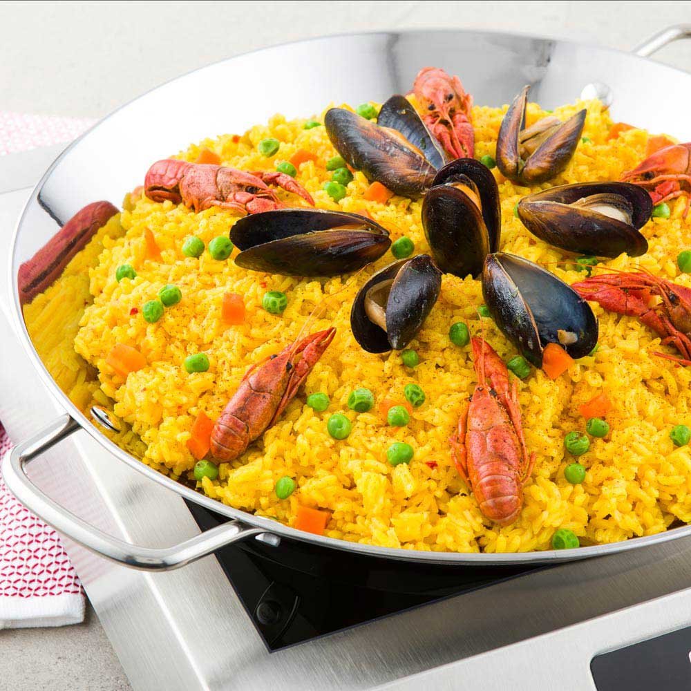 Restaurantware 10 Inch Spanish Paella Pan 1 Induction Ready Paella Pan - Heavy-Duty Riveted Handles Silver Stainless Steel Spani