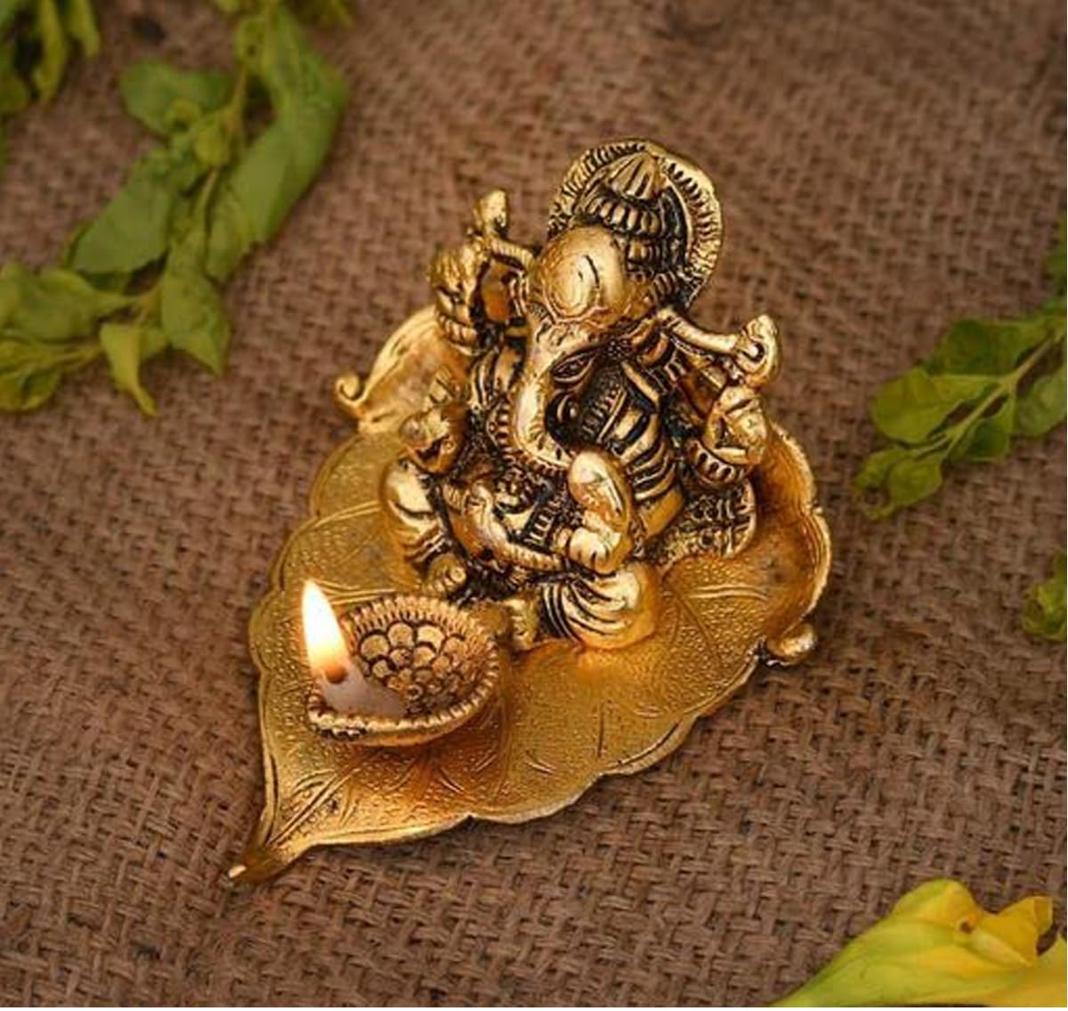 Heaven Decor Leaf Ganesh God Idol Decorative Murti With Diya Decorative Showpiece For Car And Home Temple