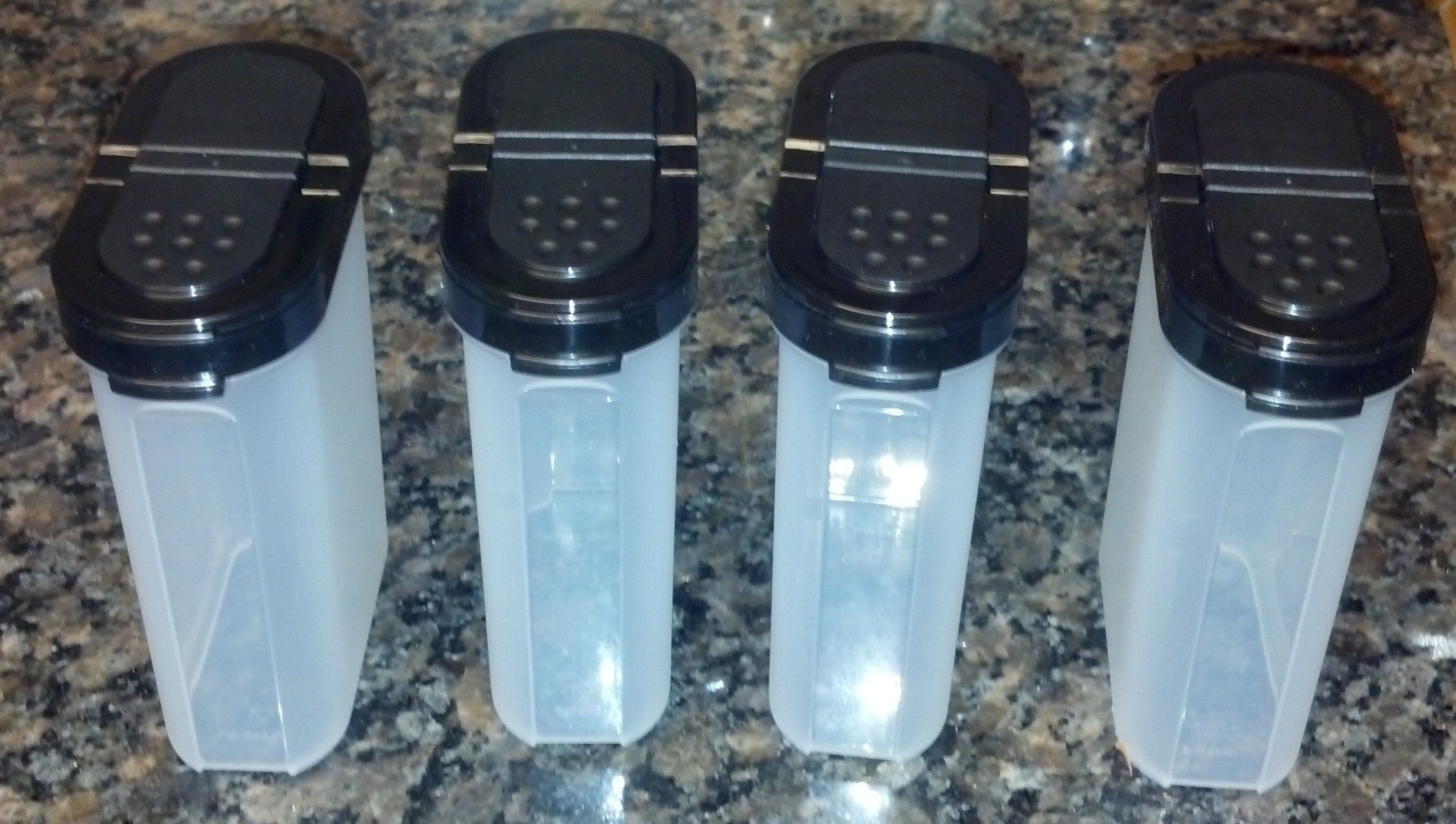 Tupperware Large Spice Shaker Set Of Four. Black Seals