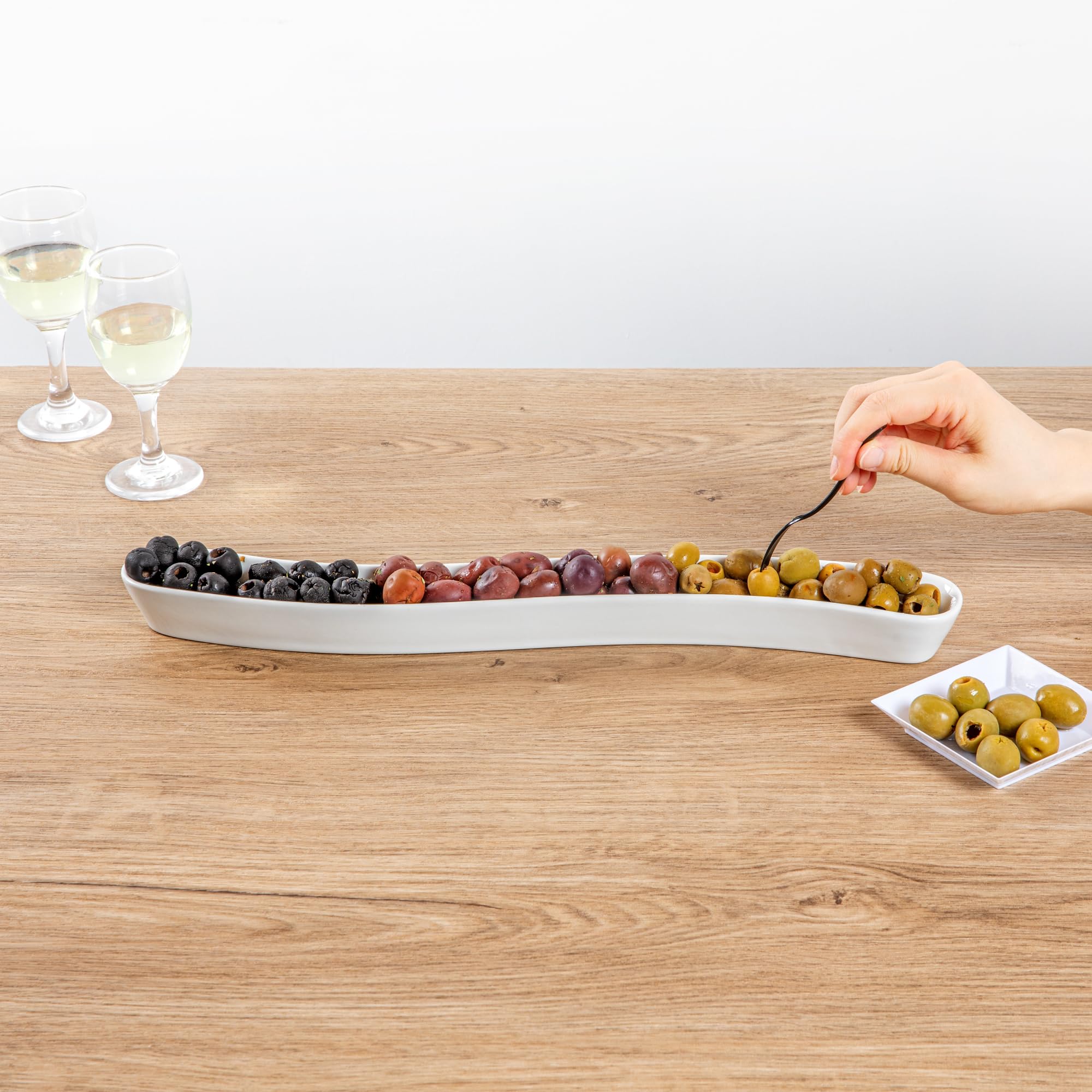 Restaurantware Swerve 14 Ounce Olive Plate 1 Curved Olive Tray - Small Chip Resistant White Porcelain Olive Canoe Dishwasher Saf
