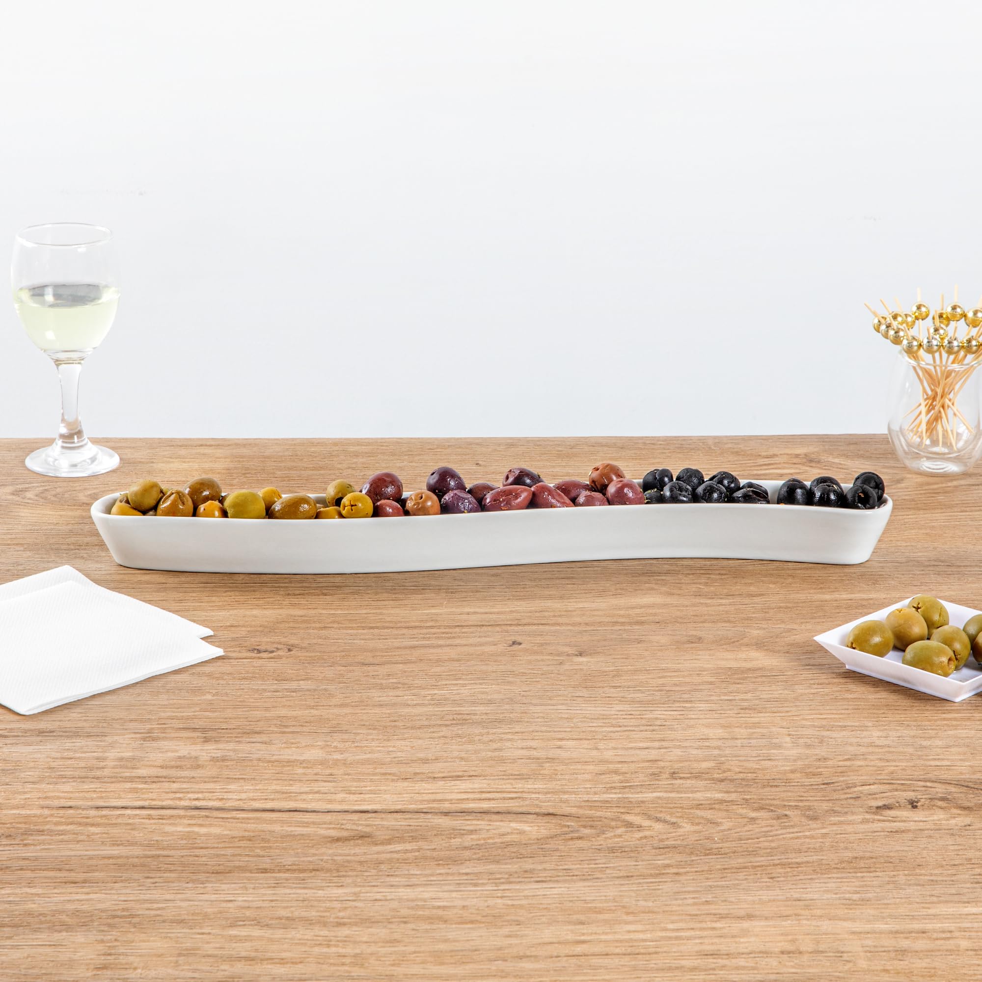 Restaurantware Swerve 14 Ounce Olive Plate 1 Curved Olive Tray - Small Chip Resistant White Porcelain Olive Canoe Dishwasher Saf