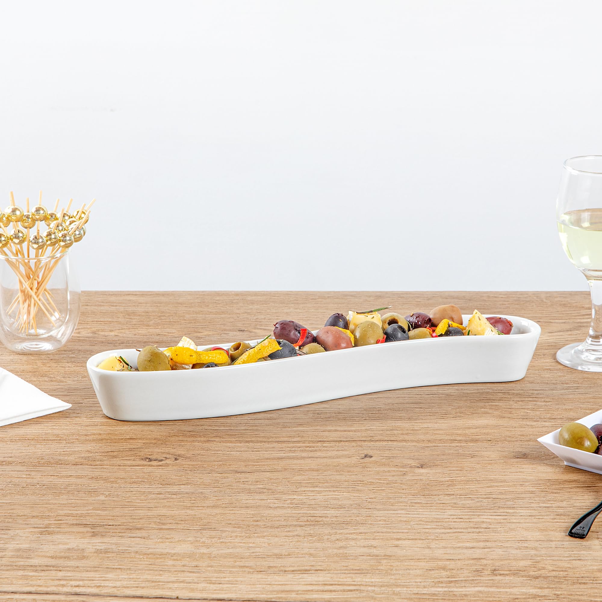 Restaurantware Swerve 10 Ounce Olive Plate 1 Curved Olive Tray - Medium Chip Resistant White Porcelain Olive Canoe Dishwasher Sa