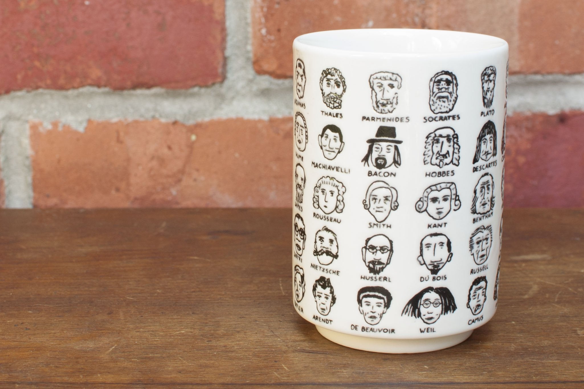 The Unemployed Philosophers Guild It'S Hard To Get A Handle On Philosophy - Porcelain Handleless Tea Cup Featuring 60 Illustrate