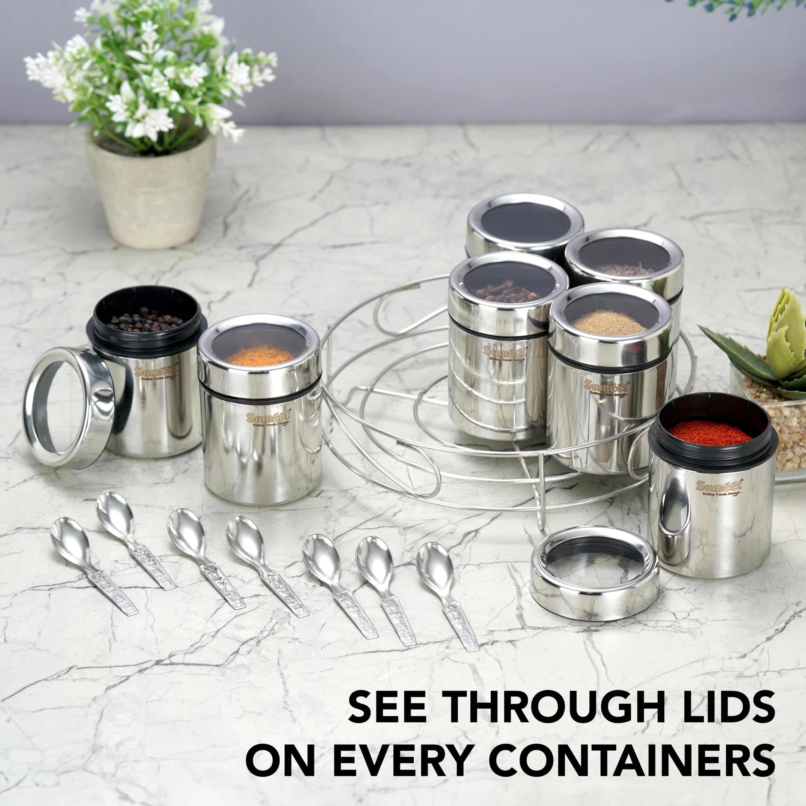 Sumeet 7In1 Stainless Steel + See Through Lid Masala Stand/Dry Fruit Stand With Stand And 7 Spoons