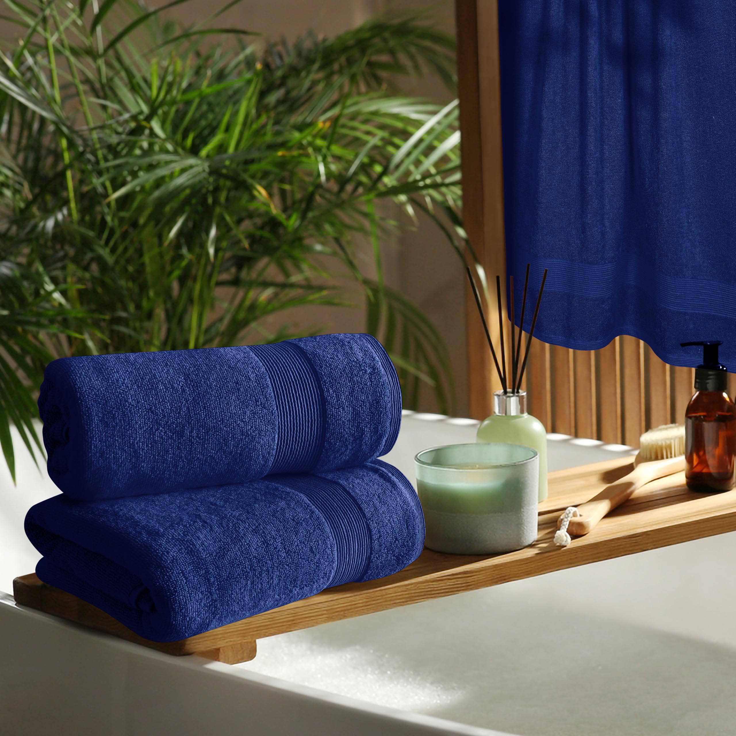 Belizzi Home 4 Pack Bath Towel Set 27x54  100% Ring Spun Cotton  Ultra Soft Highly Absorbent Machine Washable Hotel Spa Quality Bath Towels for Bathroom  4 Bath Towels - Navy Blue