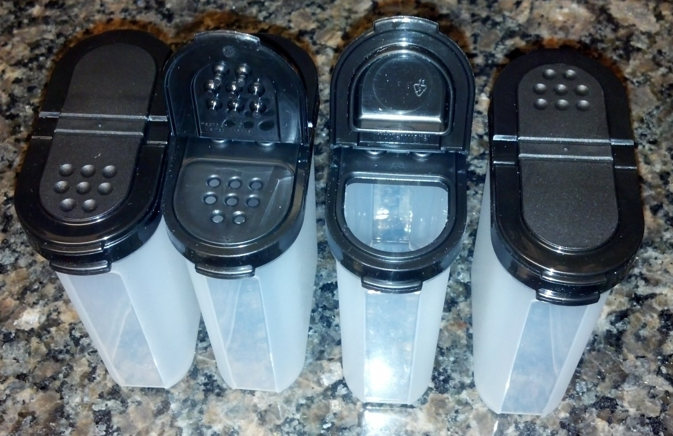Tupperware Large Spice Shaker Set Of Four. Black Seals