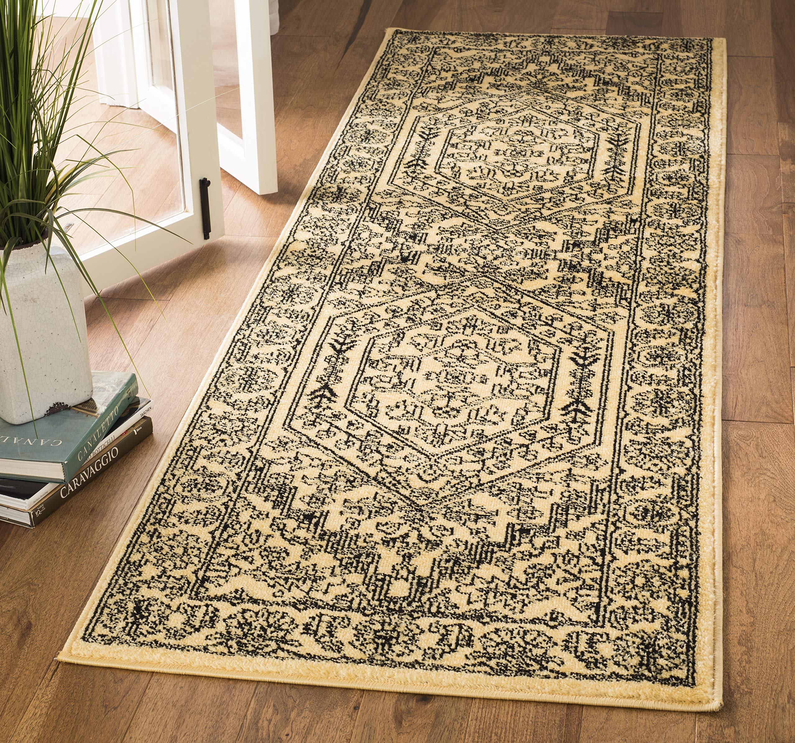 SAFAVIEH Adirondack Collection Runner Rug - 26 x 18, Gold & Black, Oriental Medallion Design, Non-Shedding & Easy Care, Ideal 