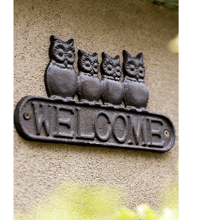 Four Owls Cast Iron Welcome Sign