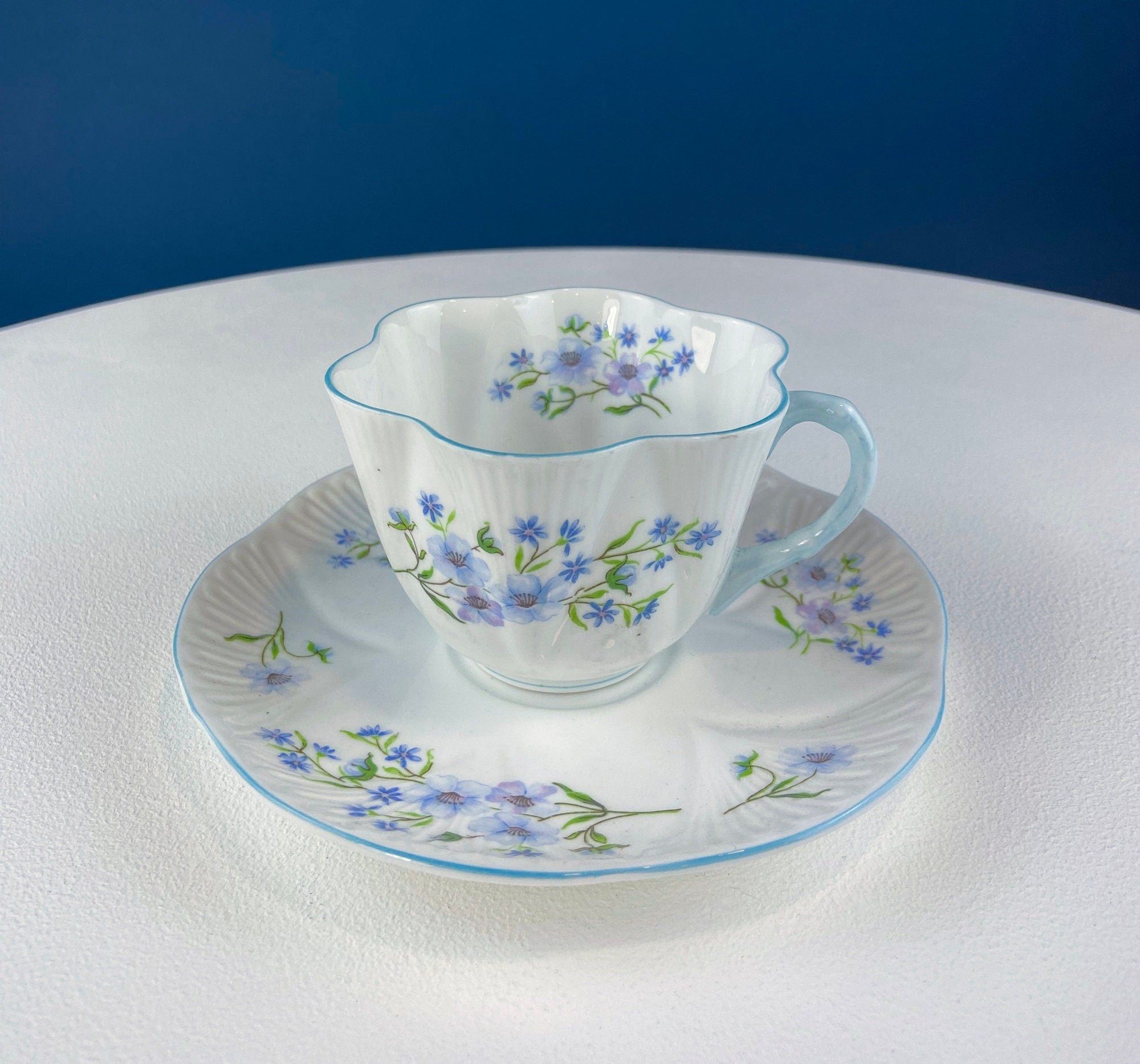 Antique Shelley Cup and Saucer with Begonia Motif . Beautiful, Fine Porcelain. Colorful Flowers and Blue Handle. French Country Living.