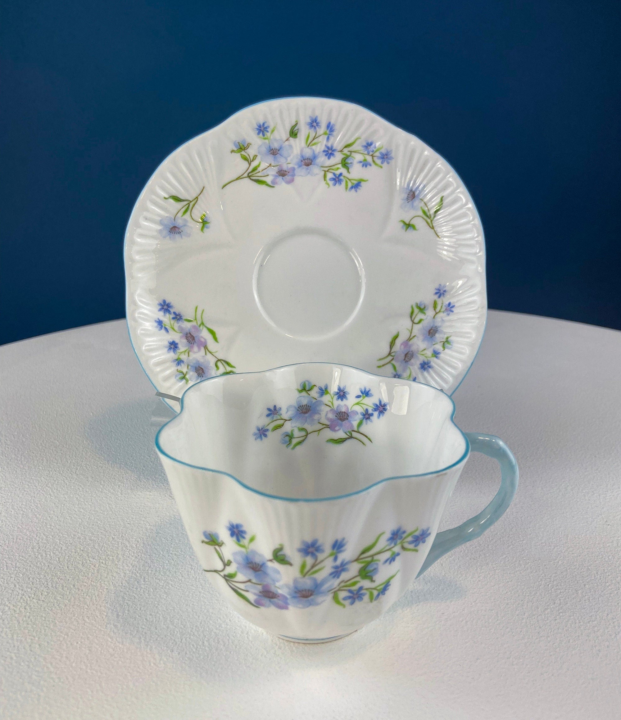 Antique Shelley Cup and Saucer with Begonia Motif . Beautiful, Fine Porcelain. Colorful Flowers and Blue Handle. French Country Living.