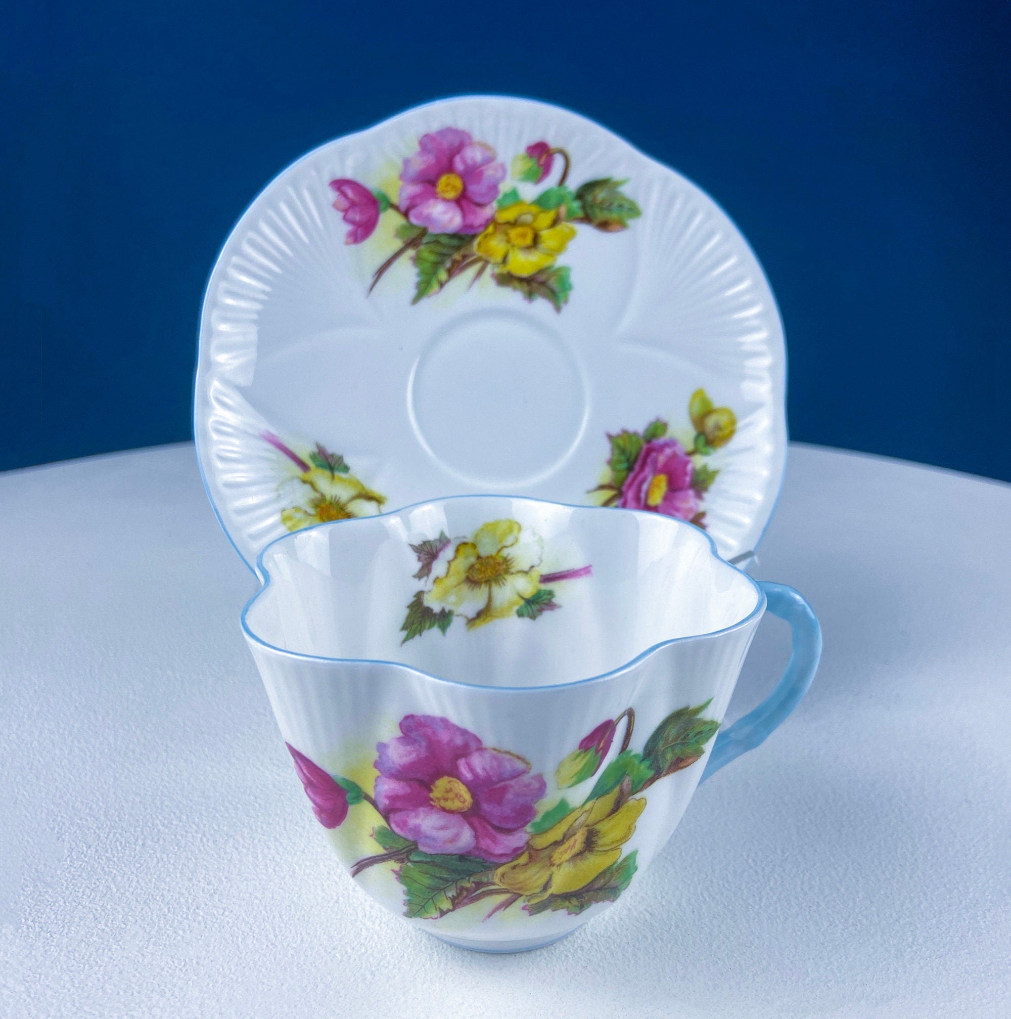 Antique Shelley Cup and Saucer with Begonia Motif . Beautiful, Fine Porcelain. Colorful Flowers and Blue Handle. French Country Living.