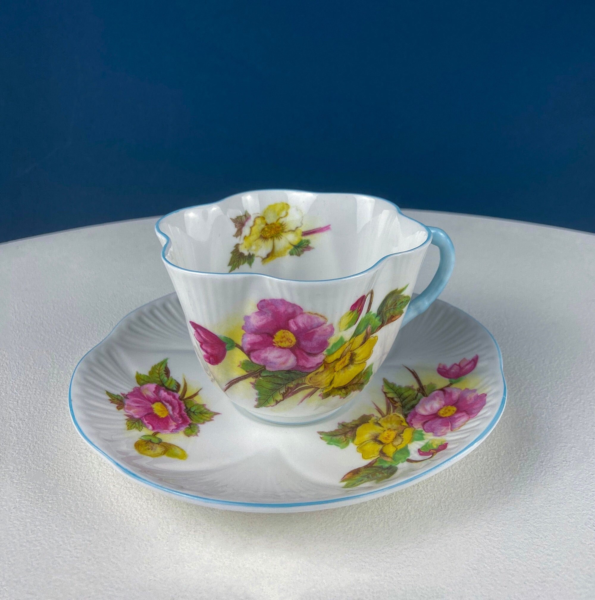 Antique Shelley Cup and Saucer with Begonia Motif . Beautiful, Fine Porcelain. Colorful Flowers and Blue Handle. French Country Living.